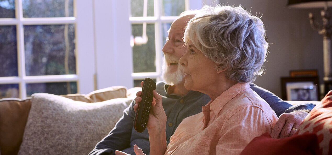 Older women using the dish voice remote